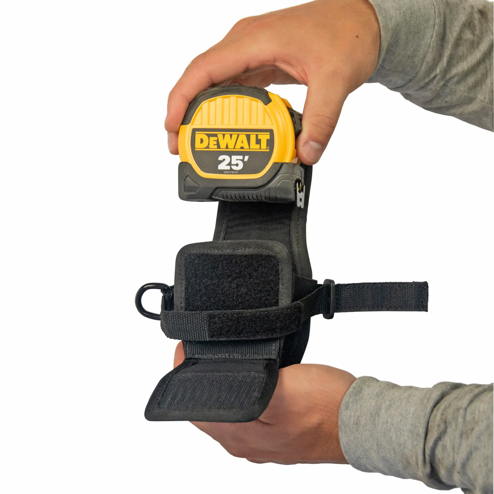 Front view of the DEWALT Tape Measure Holder open to insert a tape measure