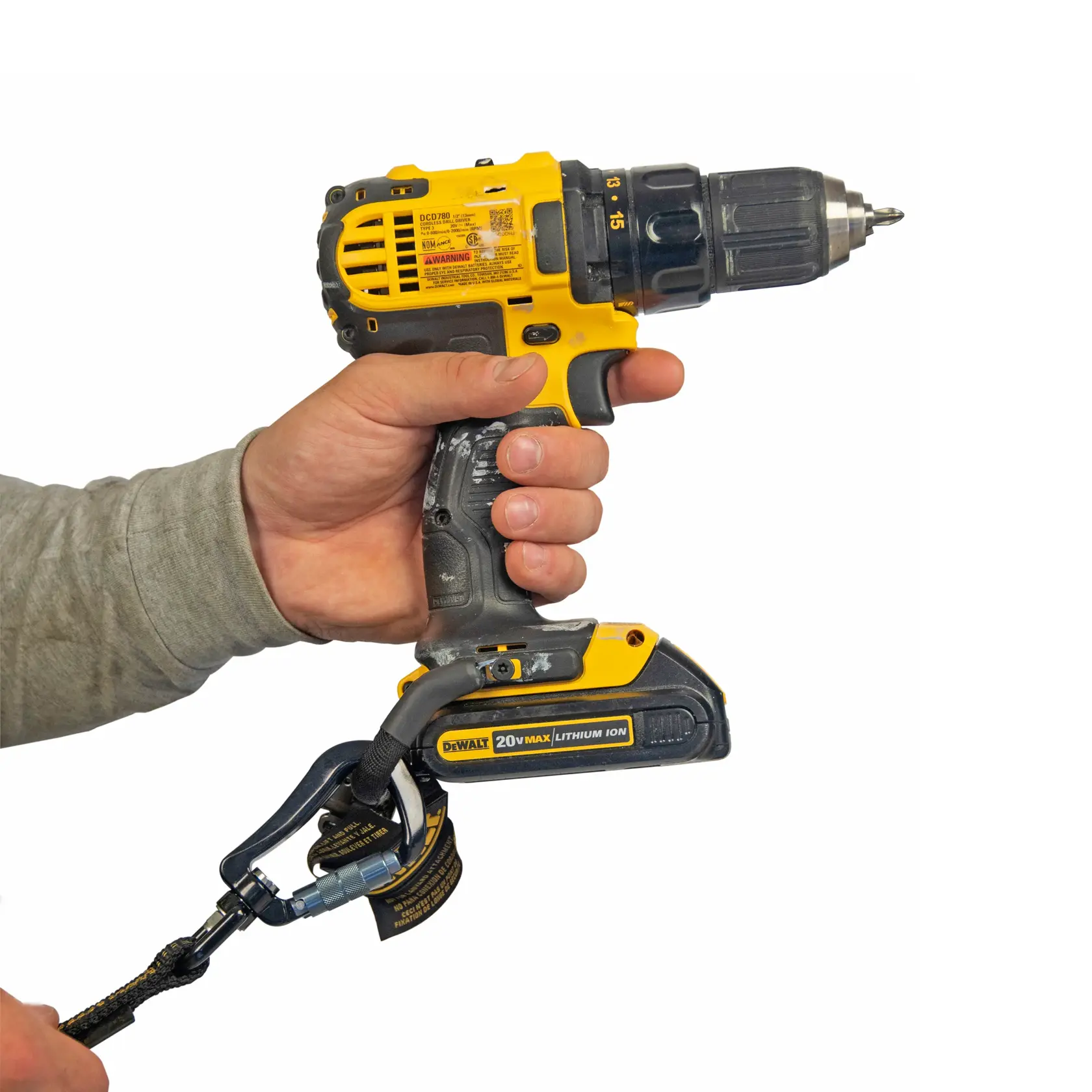 Side view of the DEWALT Power Tool Lanyard Dual Carabiner on a drill hold by workman