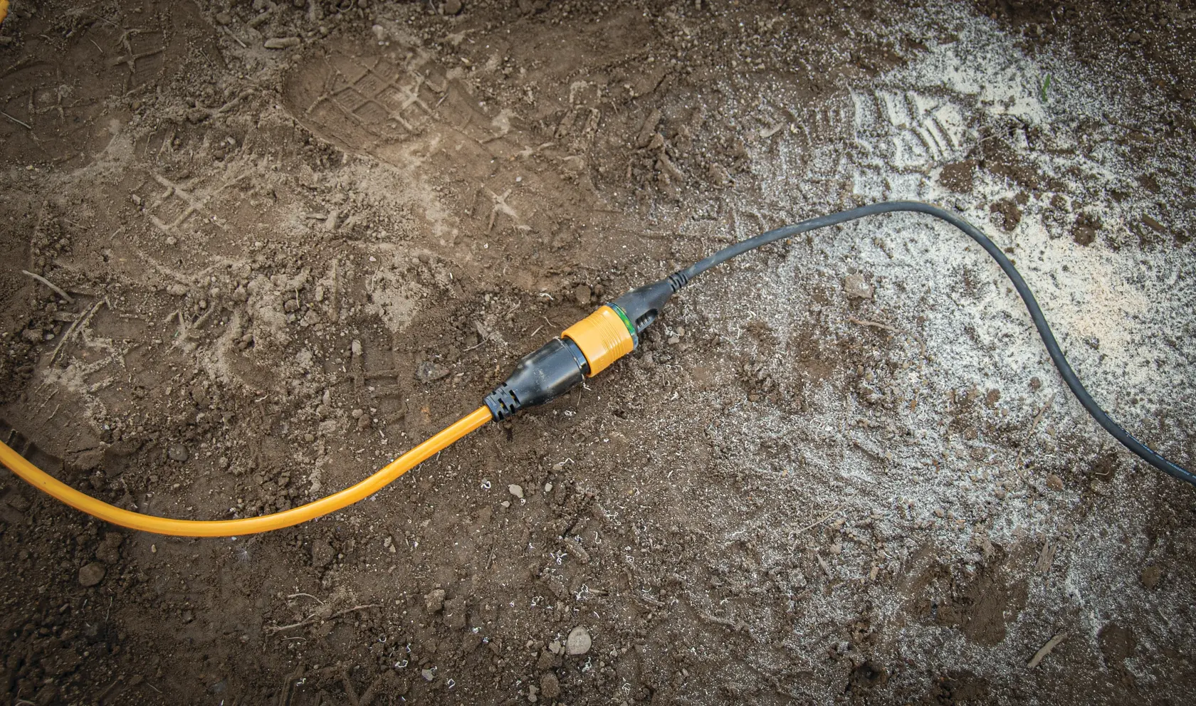 Overhead view of 50 feet twelve thirds Lighted Locking C G M Extension Cord connected to cable.