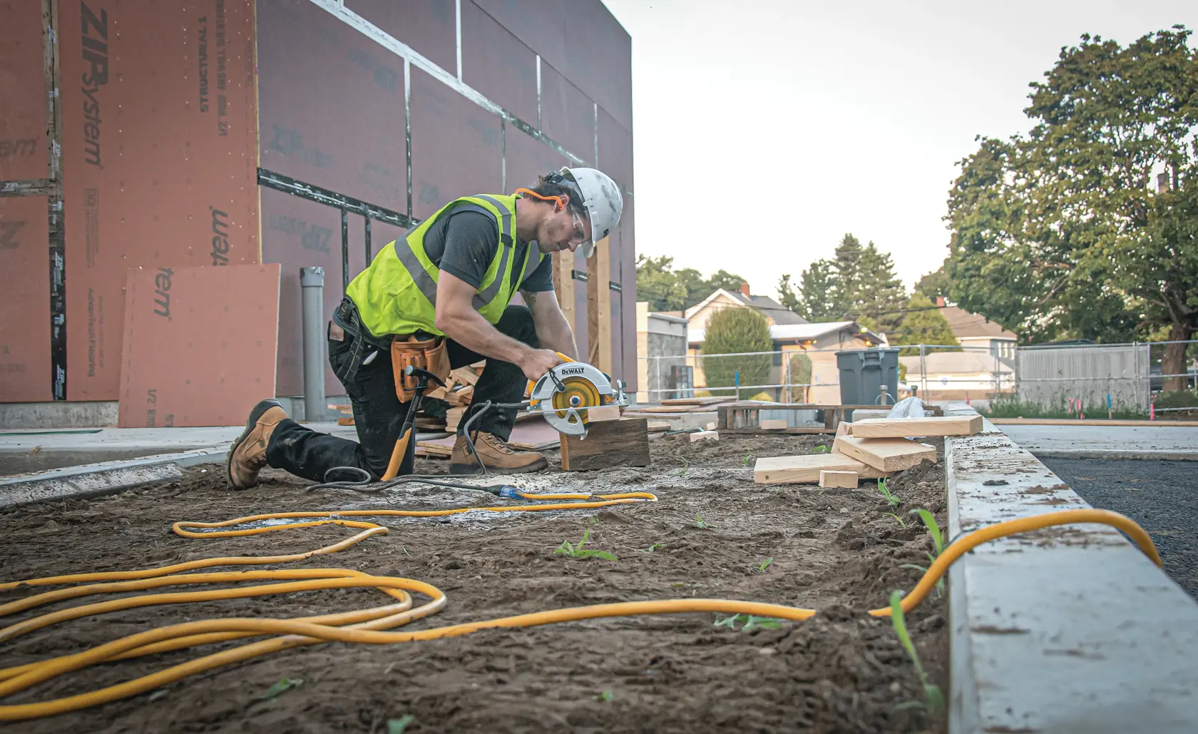25 feet twelve thirds Lighted C G M Extension Cord being used to deliver power to saw at worksite.