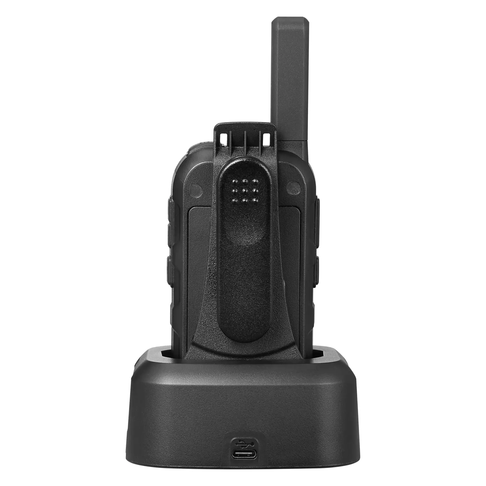 A black walkie-talkie seen from the back, standing upright in a charging dock with a USB port visible on the front of the dock.