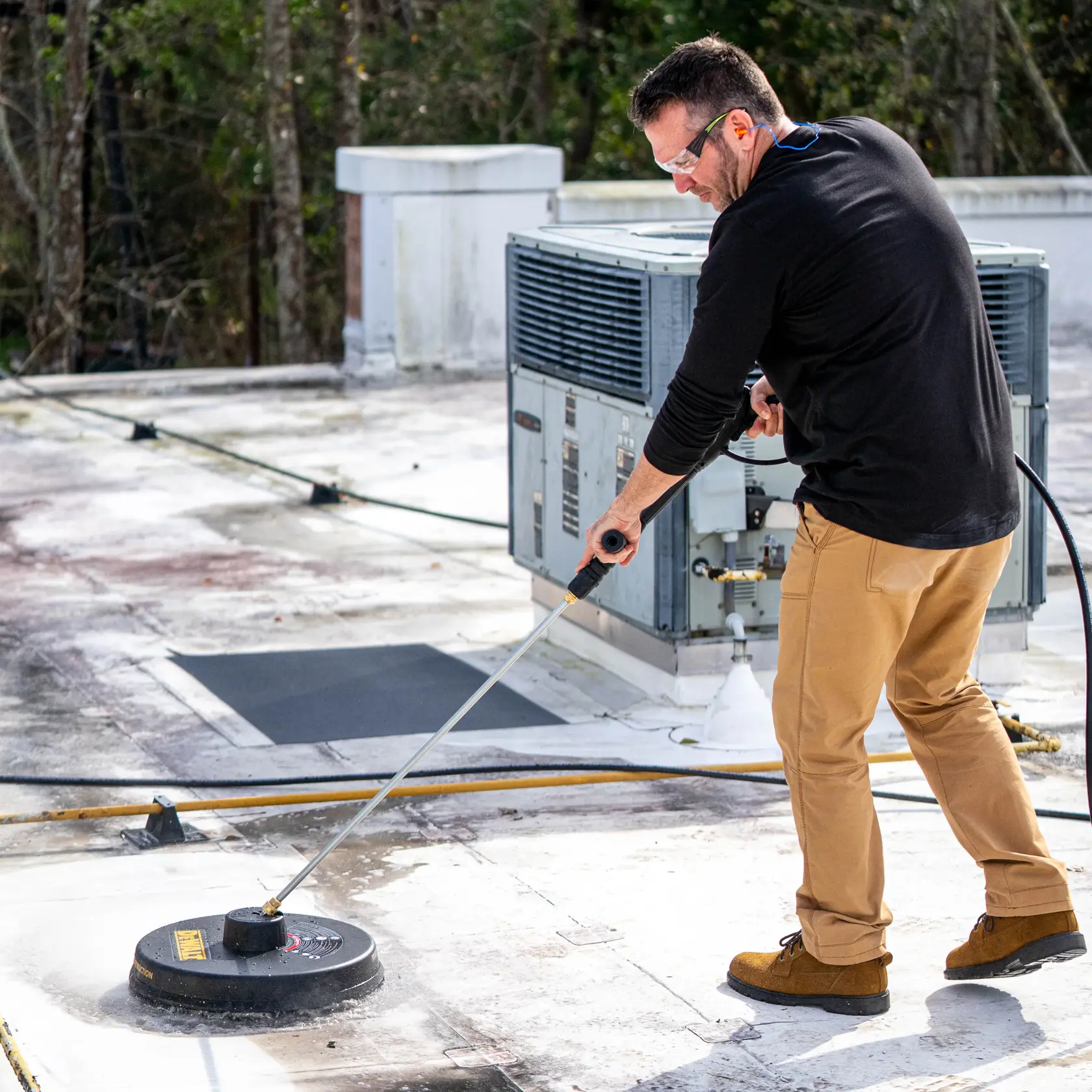 Pressure Washer 18 inch Surface Cleaner Rated 3400 PSI being used by person on floor.