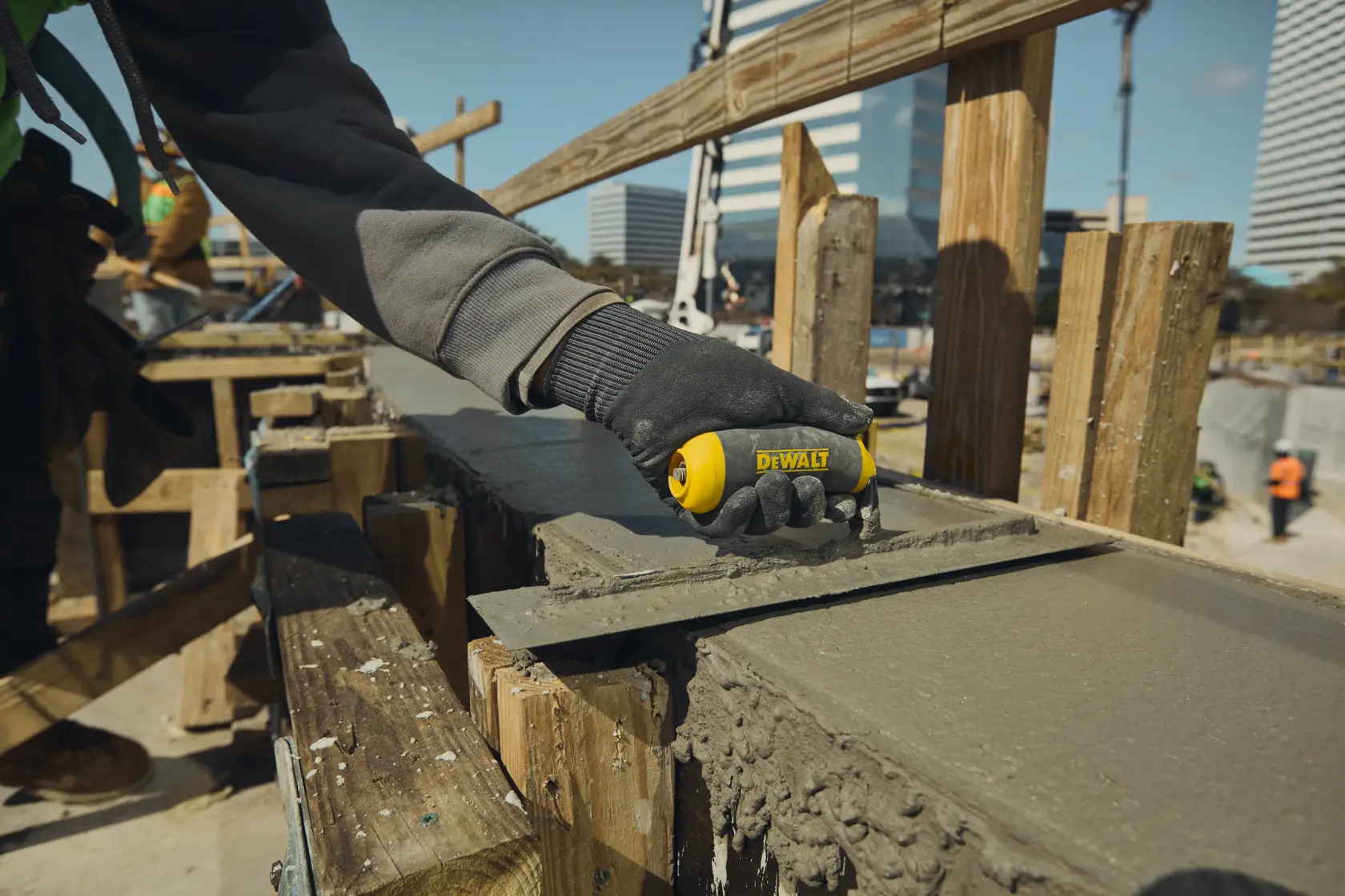 DEWALT hand trowel smoothing concrete slab