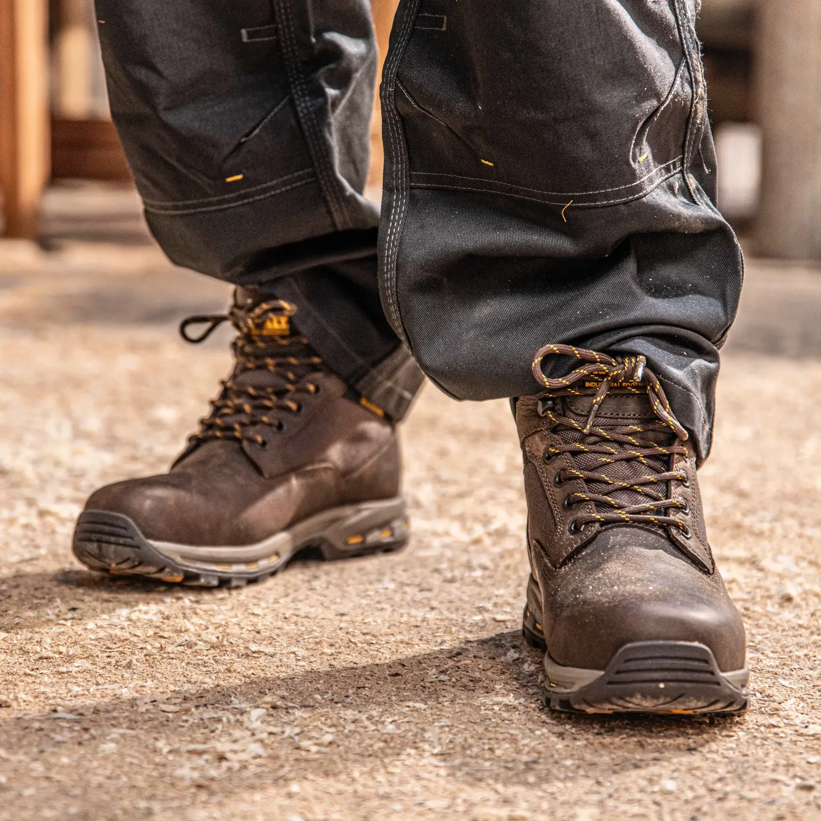 Front view of the DEWALT Halogen Lite men’s safety boot in brown on model on location