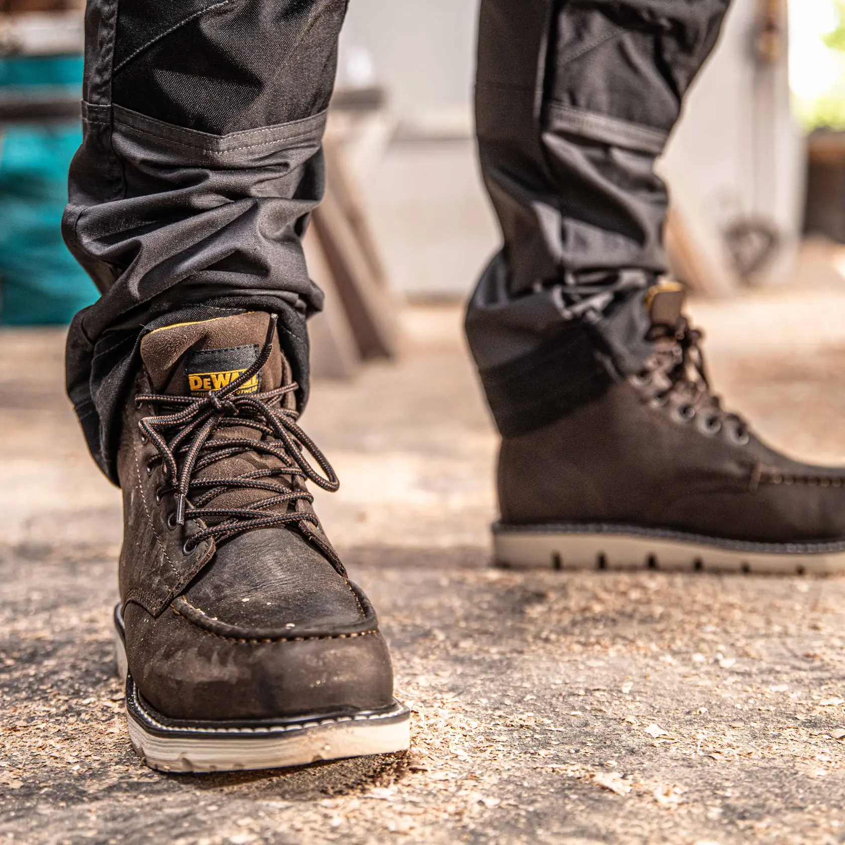 Front view of the DEWALT Forge Safety Toe Work Boot in seal brown on model on location