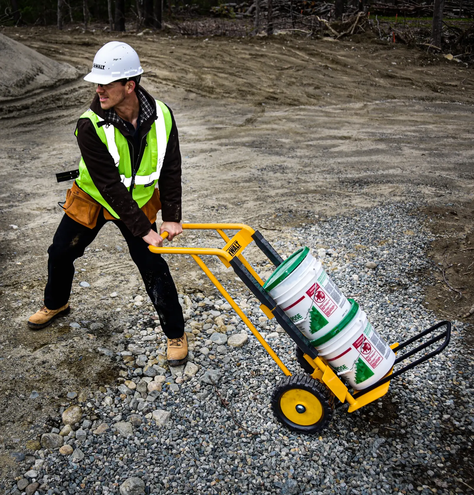DeWalt DXWT-HT100-KIT Steel Hand Truck with Kit application shot - man pulling buckets on truck