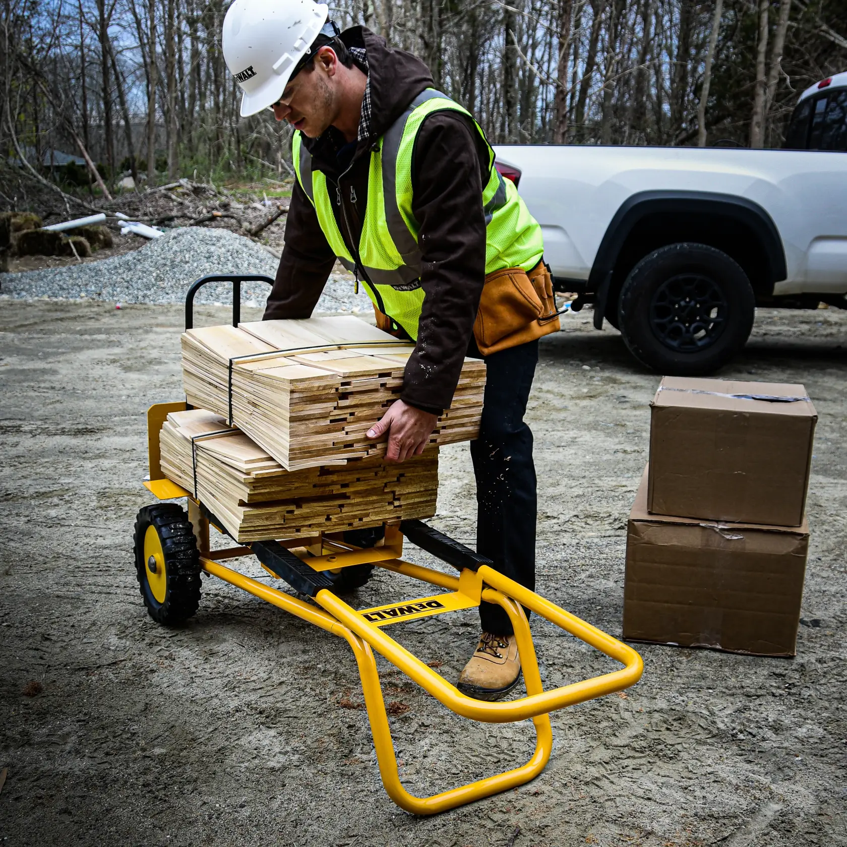 DeWalt DXWT-HT101-KIT Extended Steel Hand Truck with Kit application shot - man using truck in lay-flat position