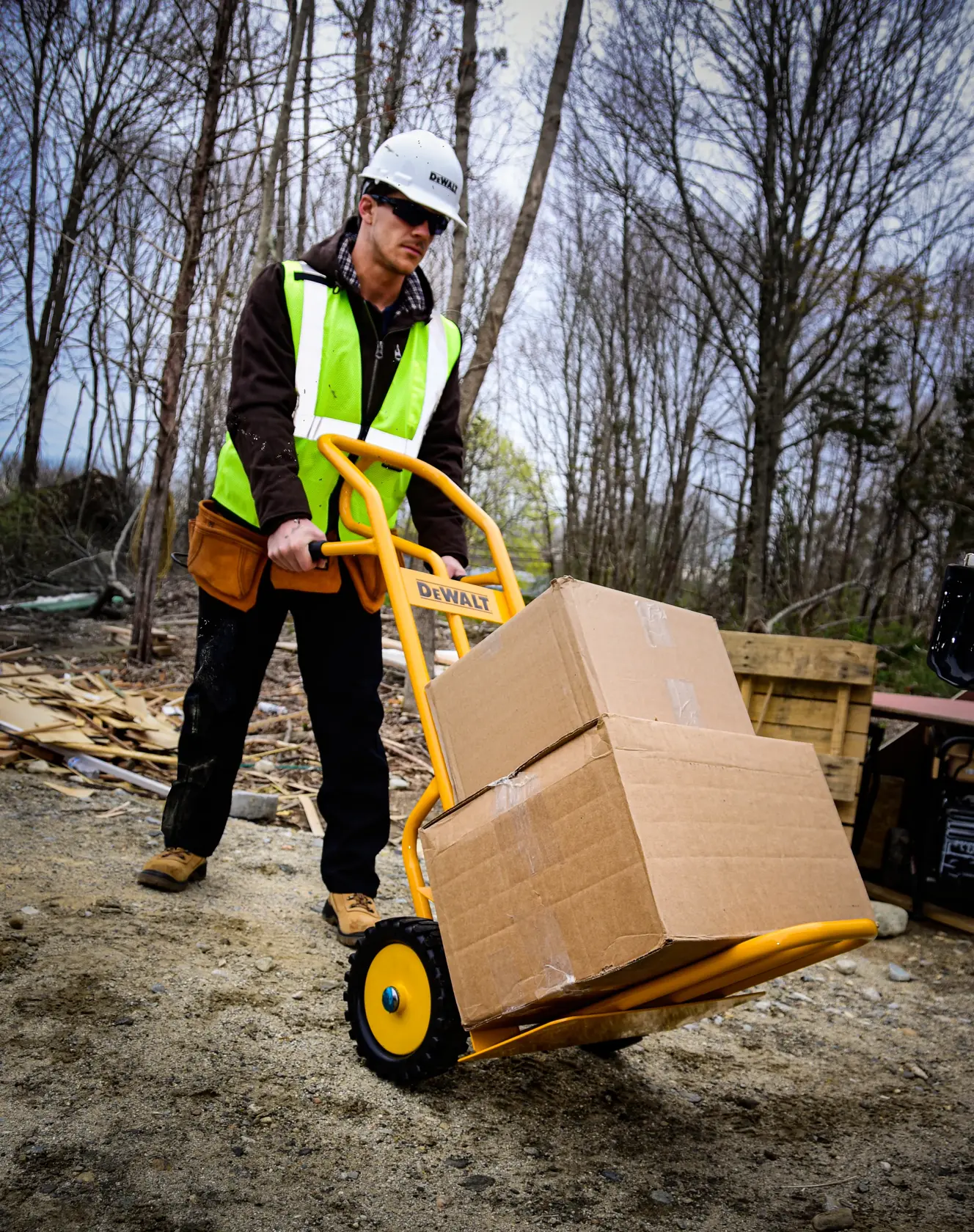 Dewalt DXWT-HT500 4-in-1 Hand Truck application shot - man pulling truck with boxes loaded