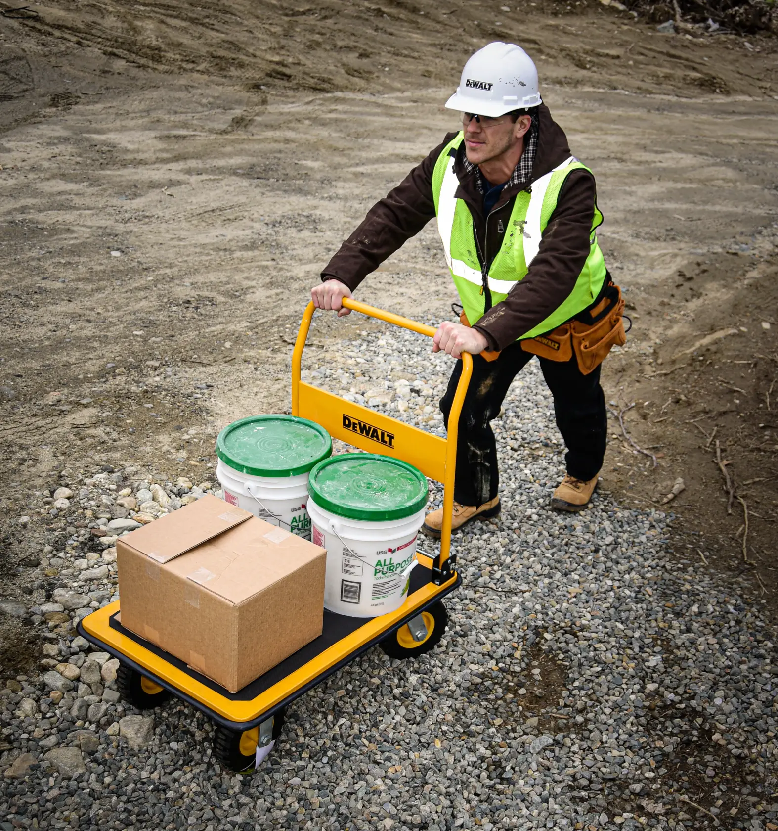 DeWalt DXWT-PC504 Steel Platform Cart application shot - man pushing loaded truck