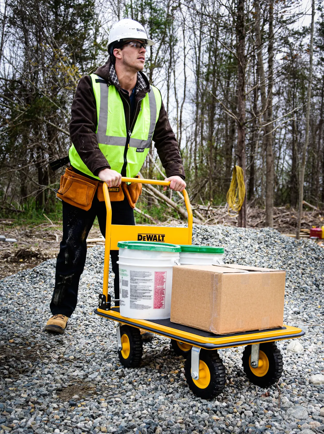 DeWalt DXWT-PC504 Steel Platform Cart application shot - man holding loaded truck