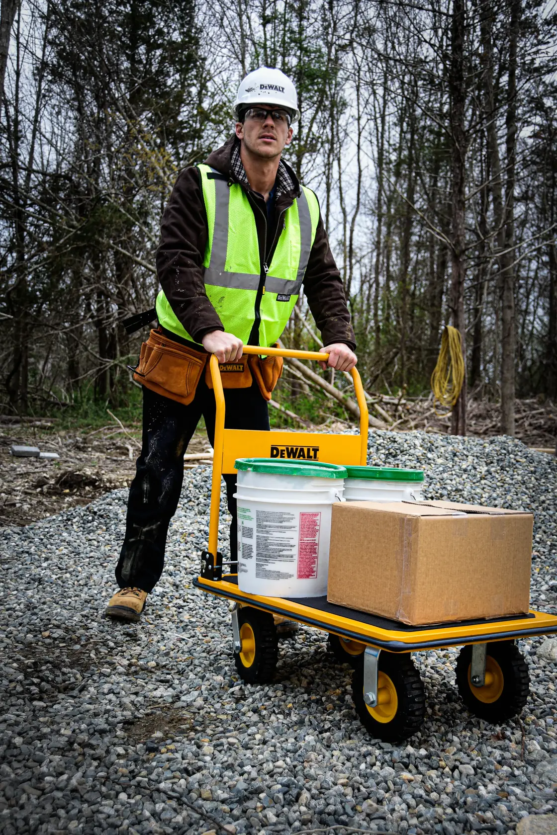 DeWalt DXWT-PC504 Steel Platform Cart application shot - man holding loaded truck