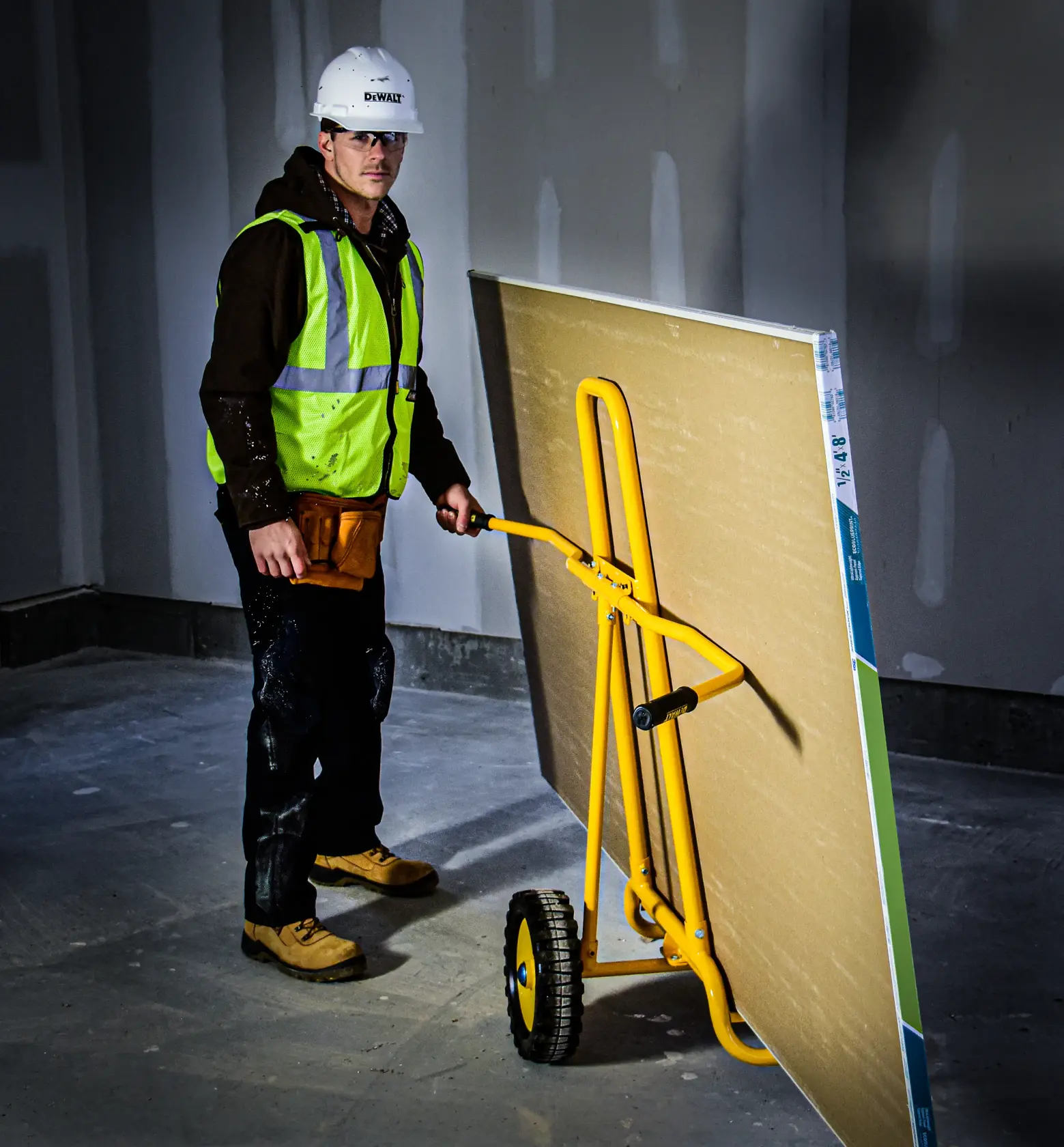 DeWalt DXWT-PS202 Steel Panel Cart application shot - man pushing large board on cart