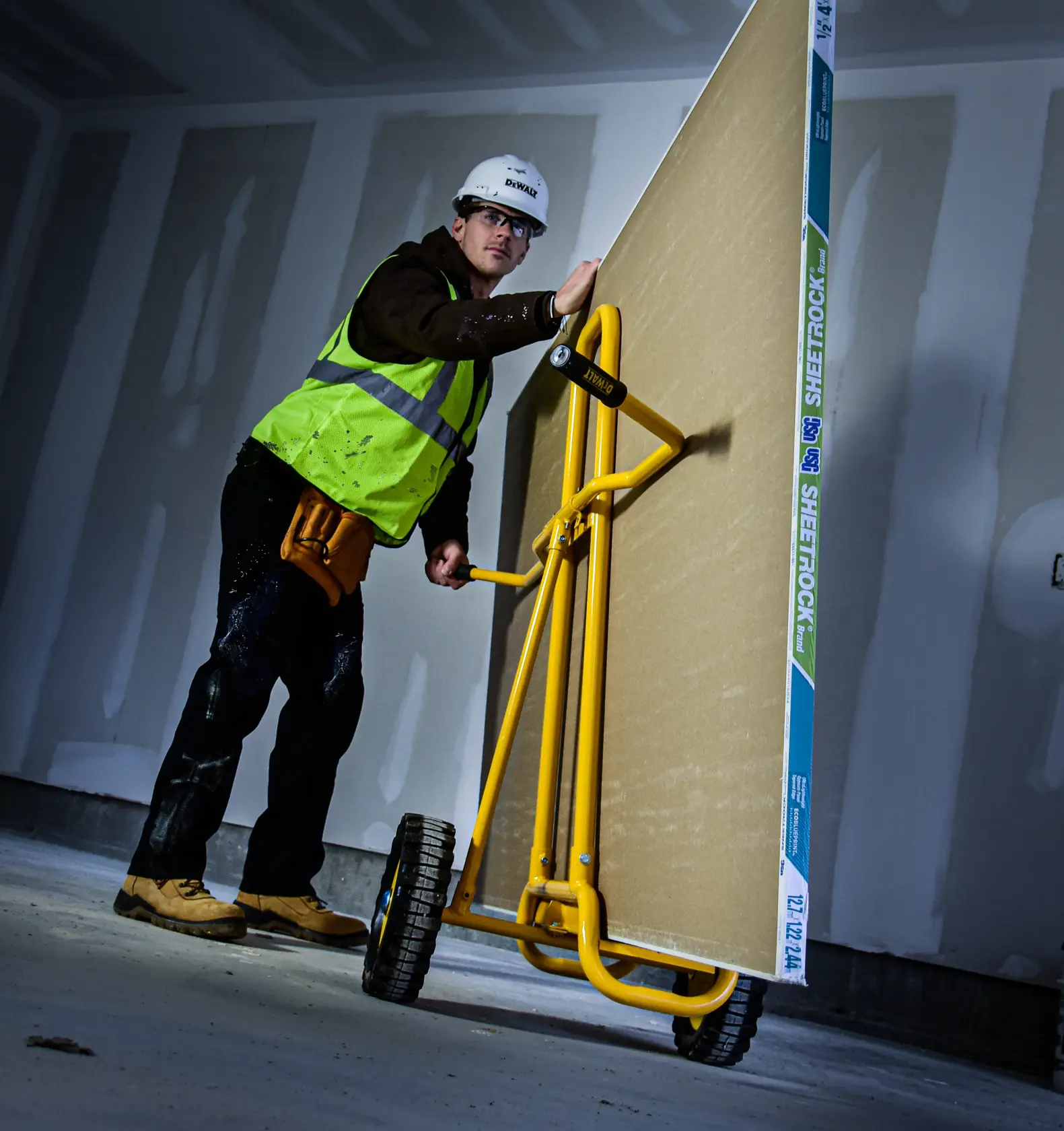 DeWalt DXWT-PS202 Steel Panel Cart application shot - man pushing large board on cart