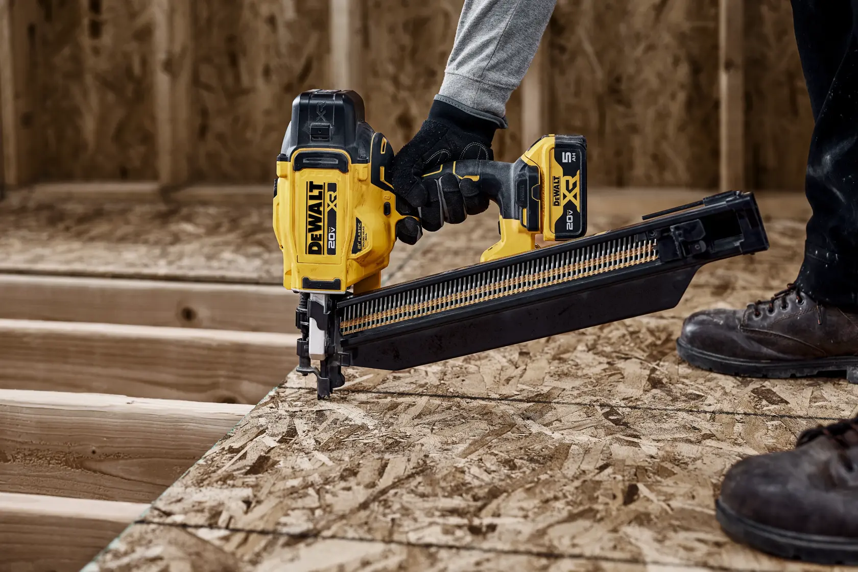 DEWALT 20V MAX* XR 21 Gauge Framing Nailer installing subfloor panels with extended magazine