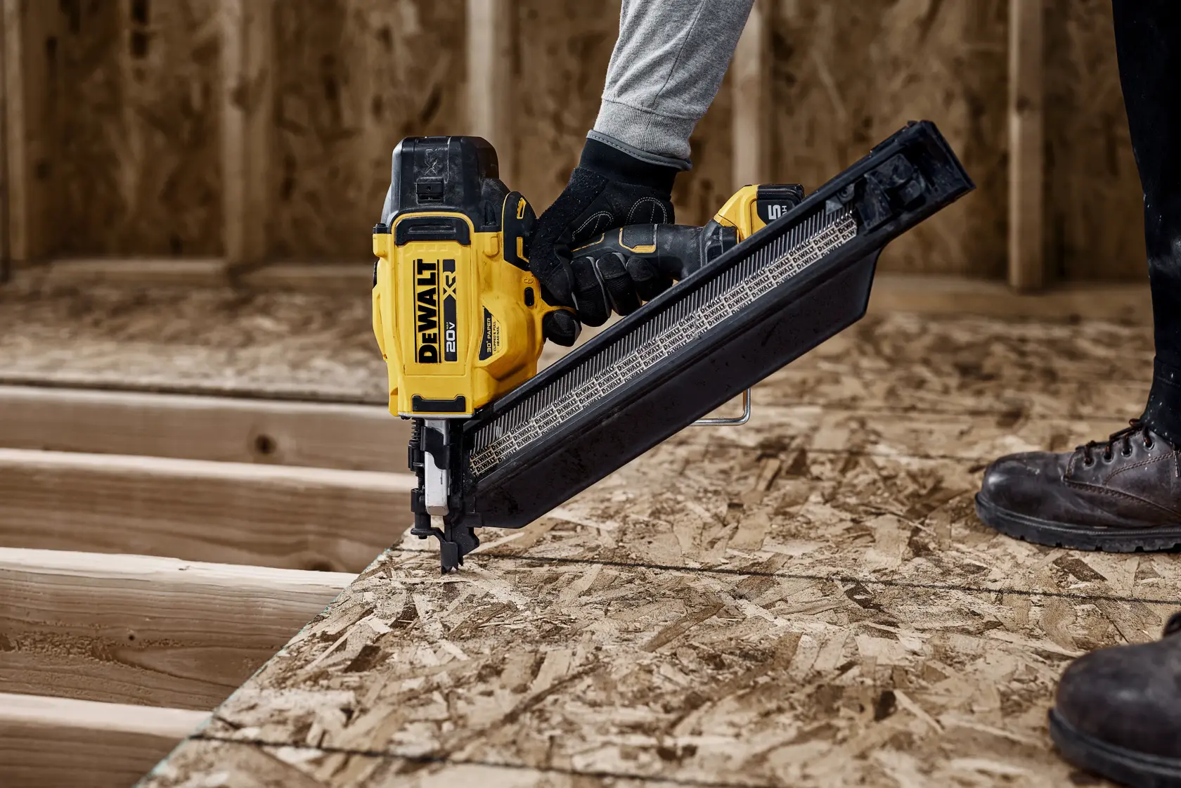 DEWALT 20V MAX* XR 30 Gauge Framing Nailer installing subfloor panels with extended magazine